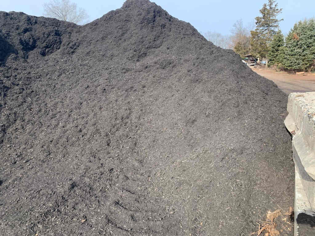 Large pile of black mulch